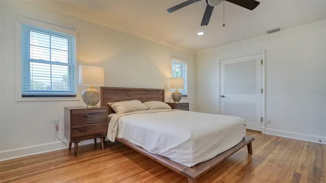 a view of a white house with a yard