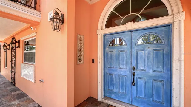 a backyard of a house with a table and chairs