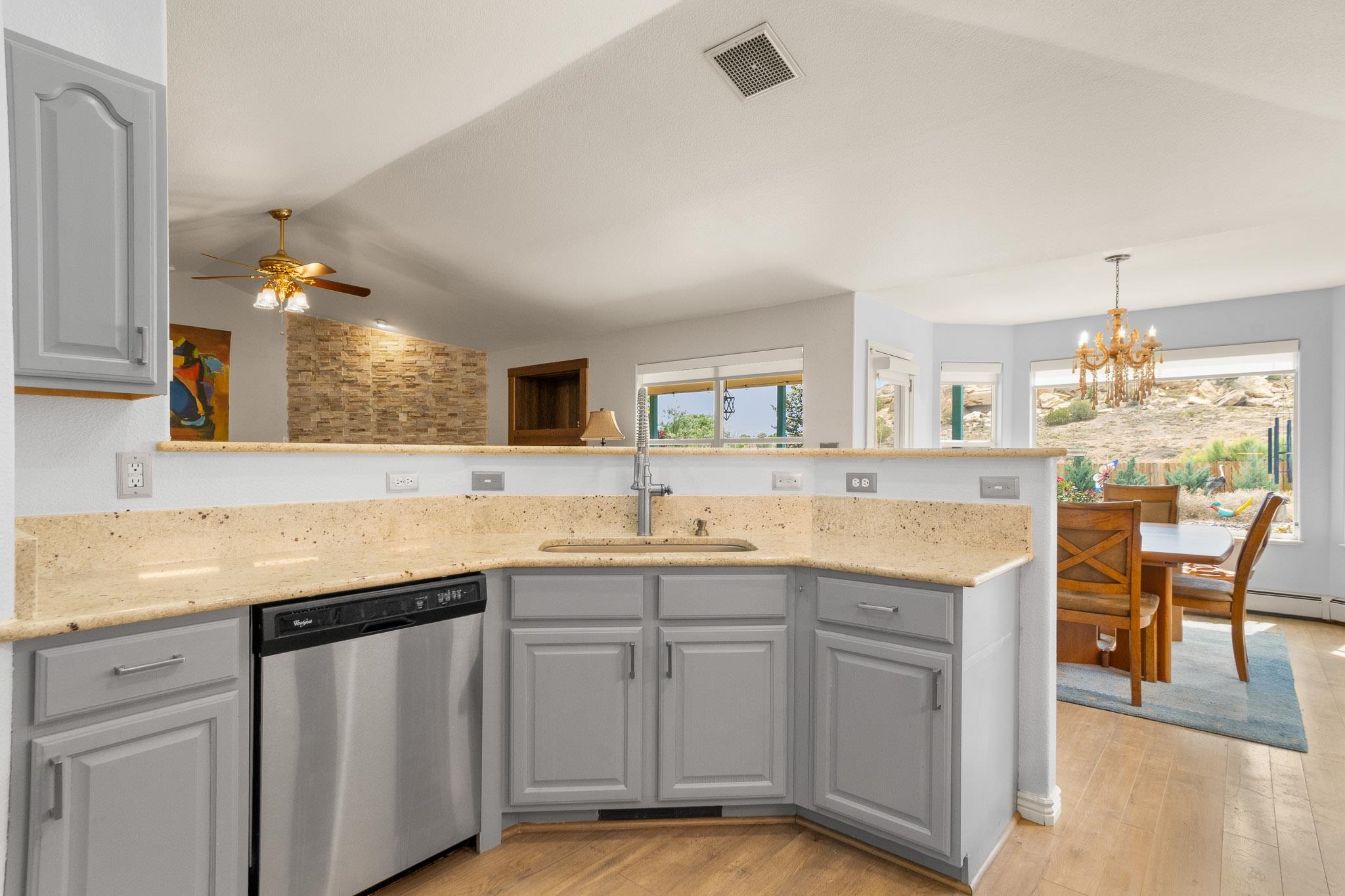 398 Butte Court Grand Junction, CO 81507 - Photo 9 of 33 a kitchen with a sink and cabinets