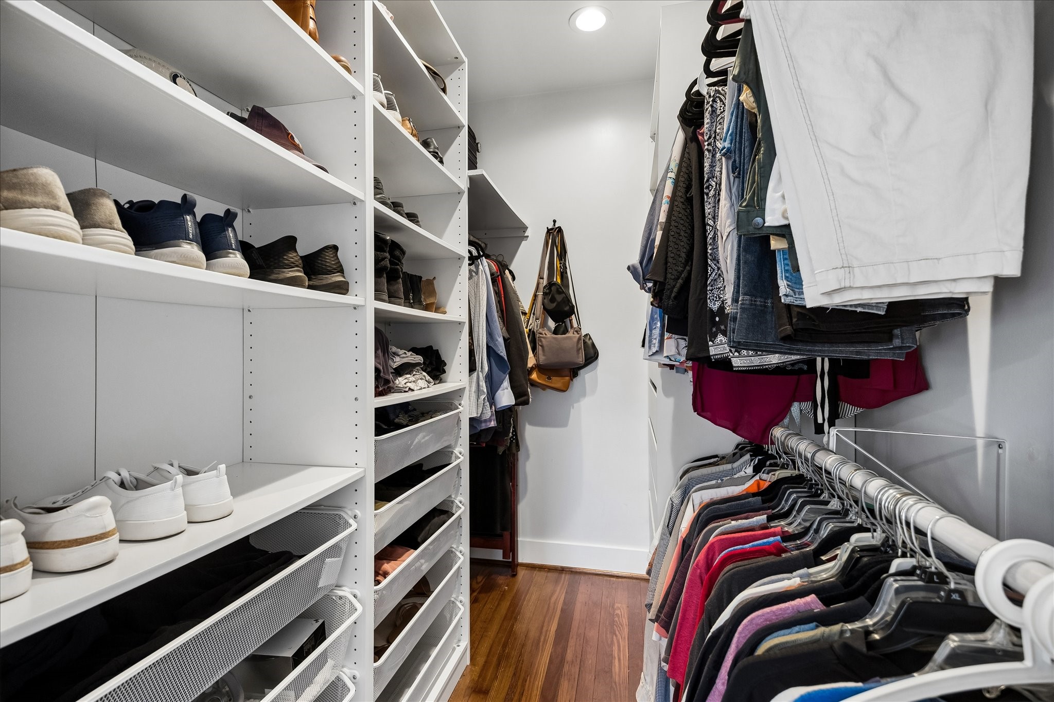 1019 East 14th Street Houston, TX 77009 - Photo 17 of 34 a view of walk in closet with clothes and shoes