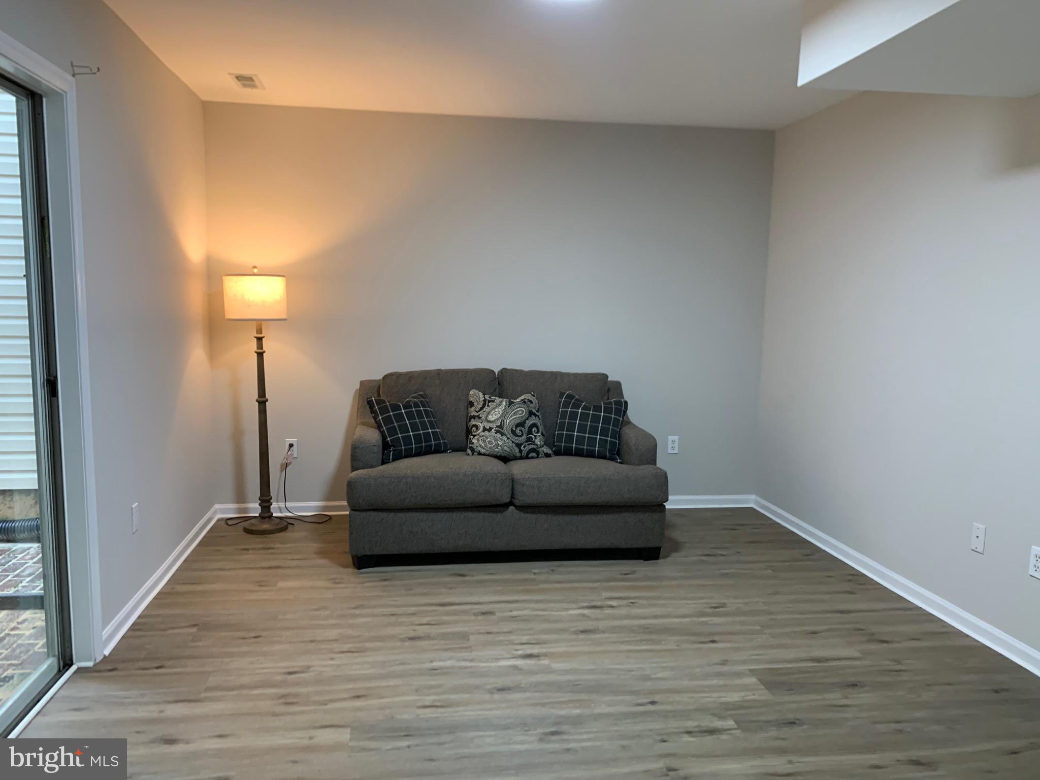 114 Sentry Ridge Smithsburg, MD 21783 - Photo 56 of 60 a living room with furniture and a rug