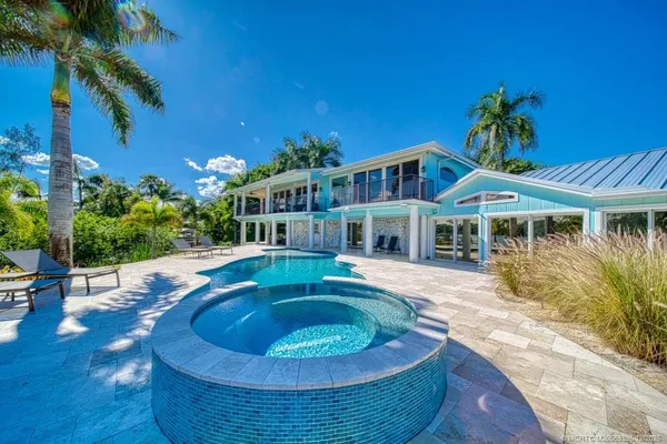 a large white kitchen with lots of counter space