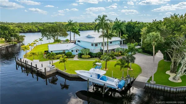 a swimming pool with outdoor seating and yard