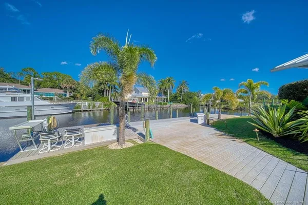 an aerial view of a house with yard swimming pool and outdoor seating