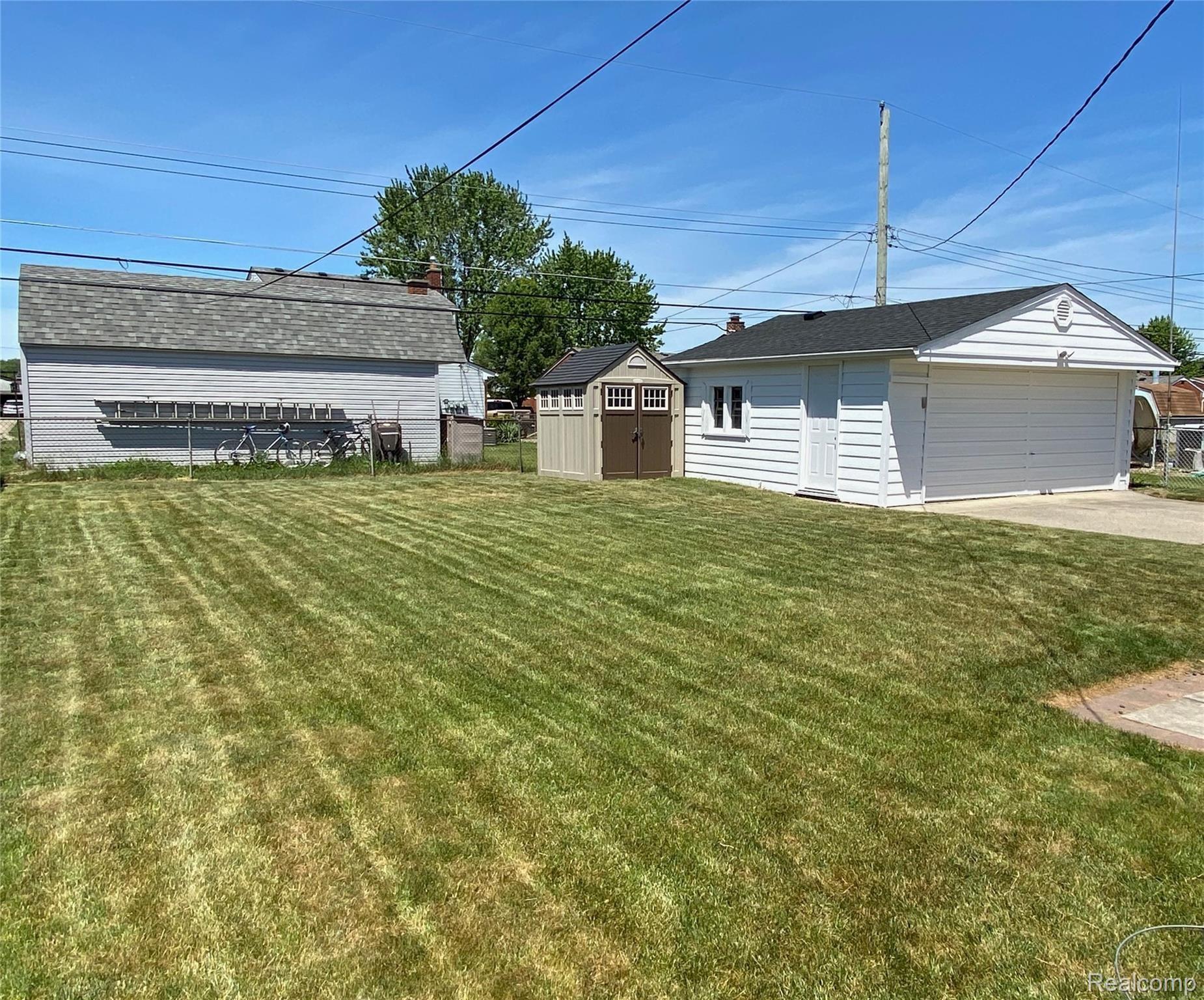 40565 Pickett Ridge Road Sterling Heights, MI 48313 - Photo 2 of 22 Spacious backyard - shed stays!