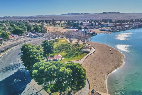 an aerial view of a house with a lake view