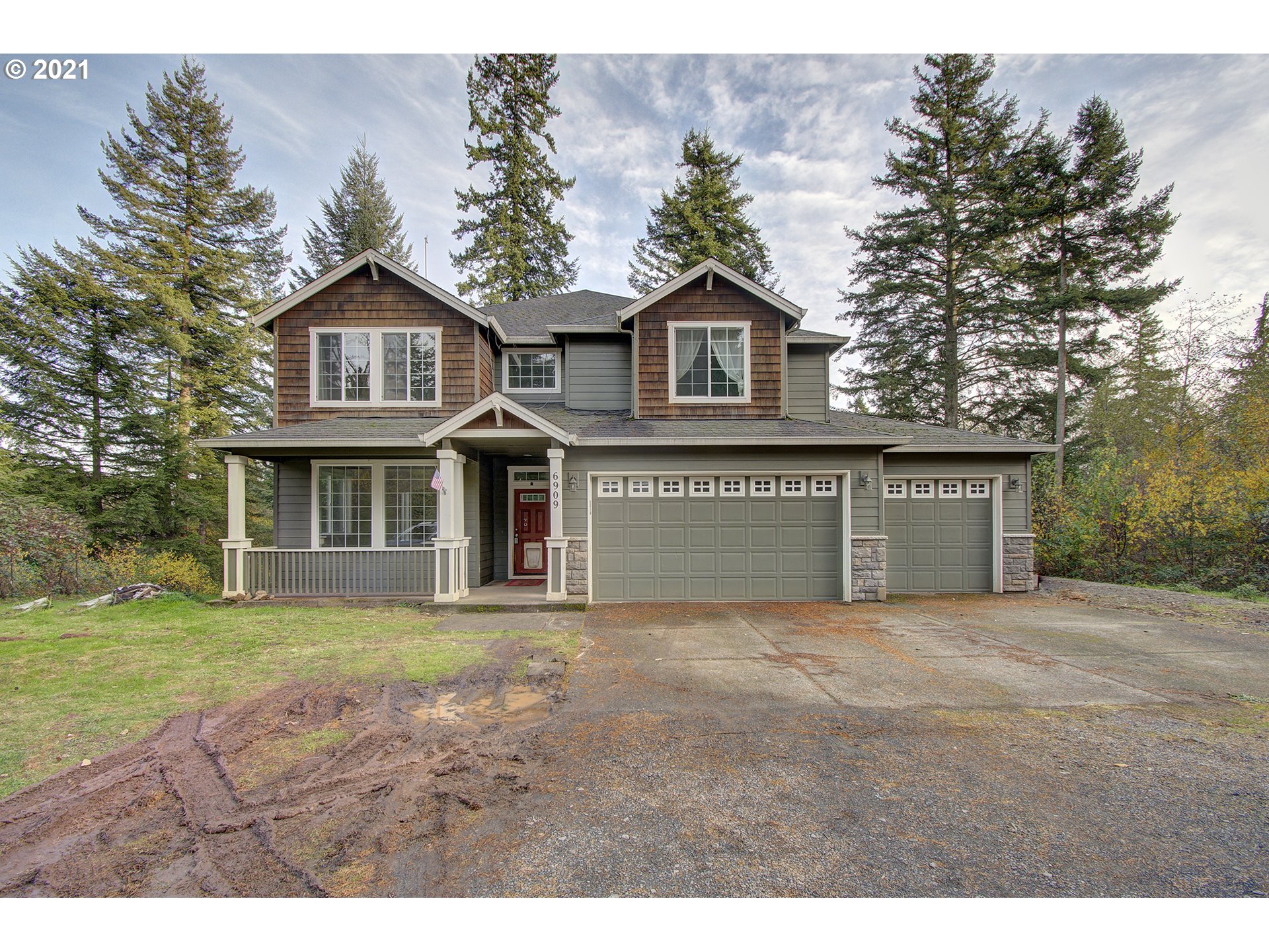 6909 Northeast Lessard Road Camas, WA 98607 - Photo 1 of 30 a front view of a house with a yard and garage
