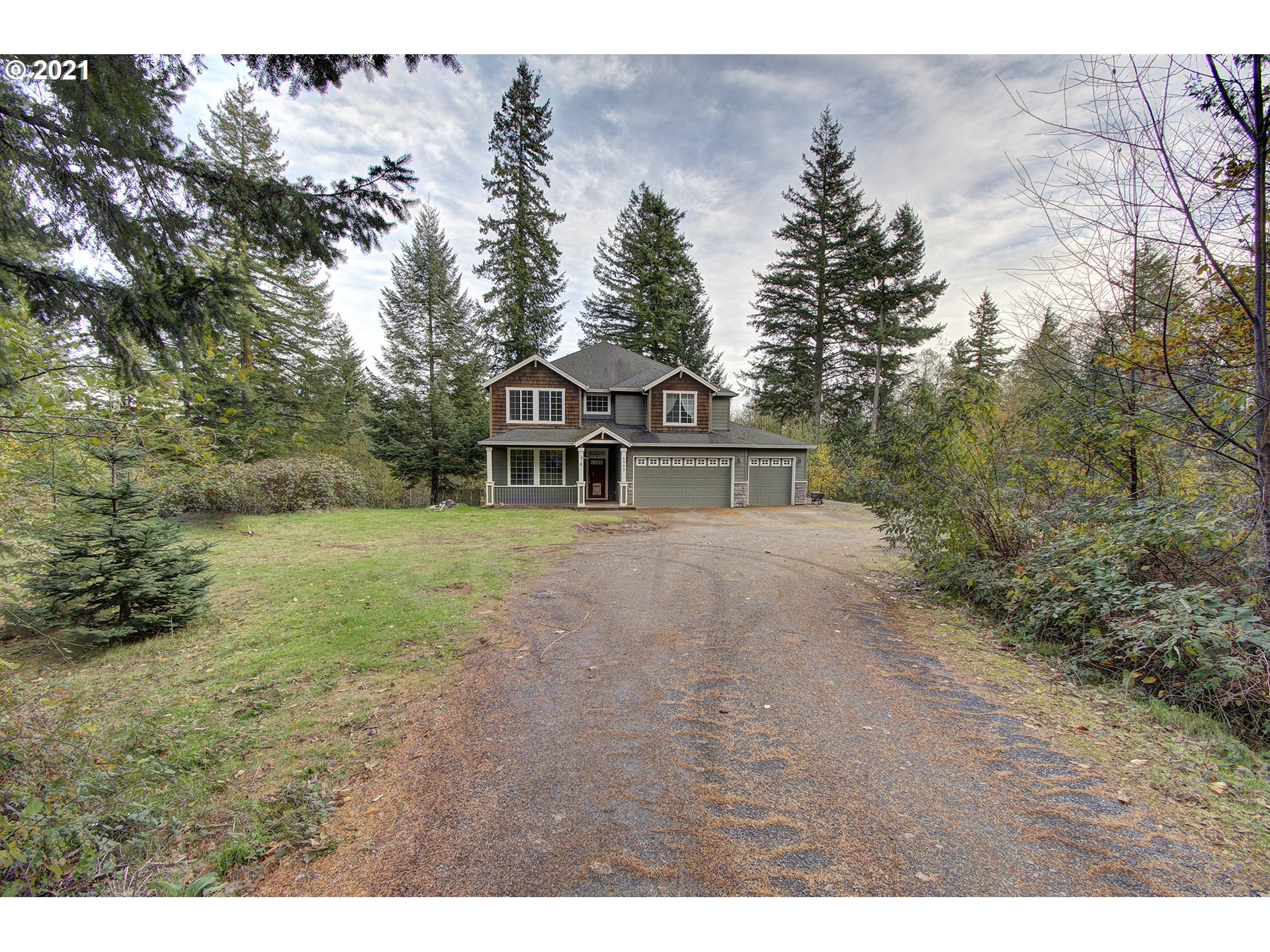 6909 Northeast Lessard Road Camas, WA 98607 - Photo 2 of 30 a view of a house with a yard