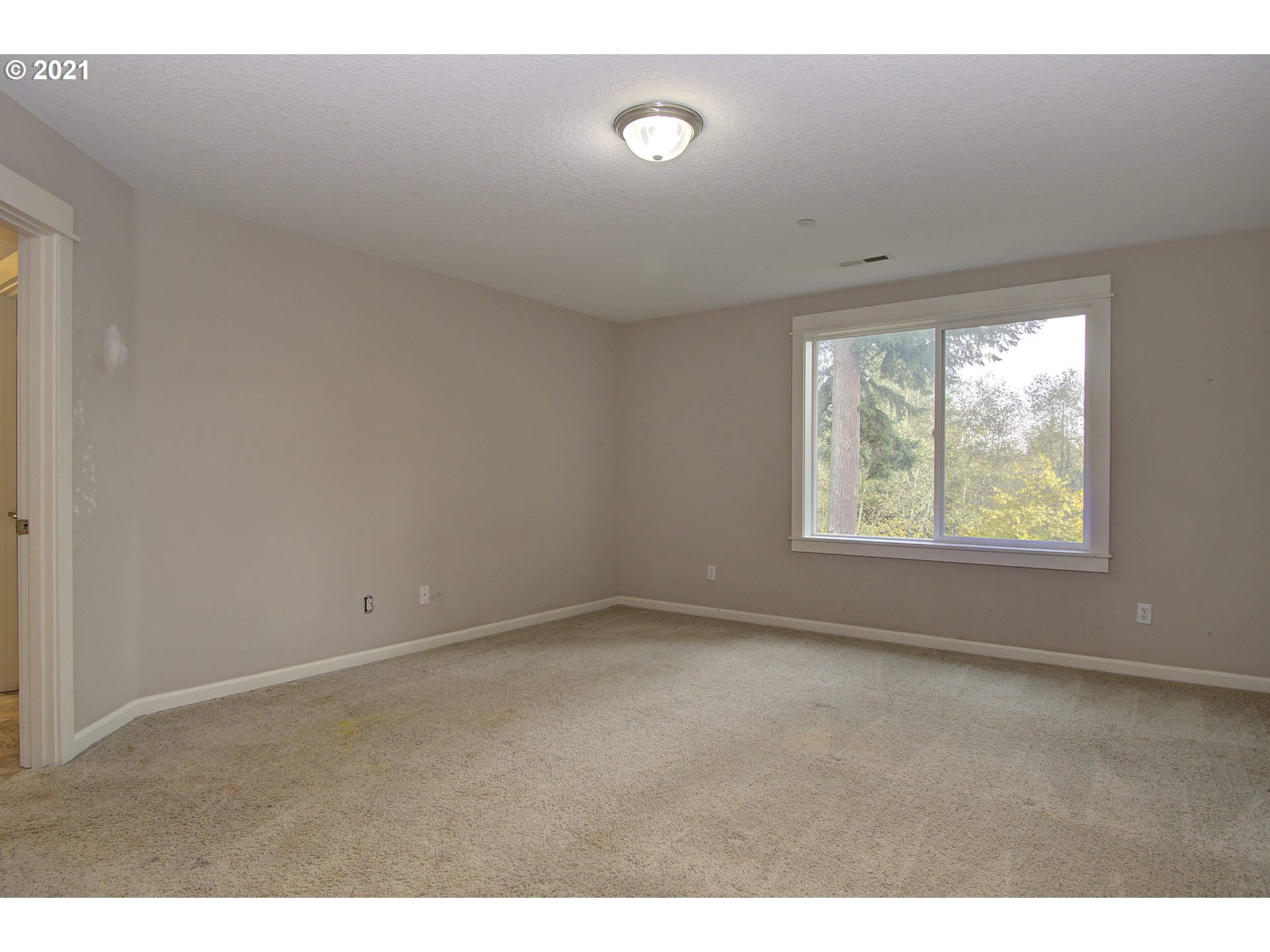 6909 Northeast Lessard Road Camas, WA 98607 - Photo 13 of 30 a view of an empty room with a window