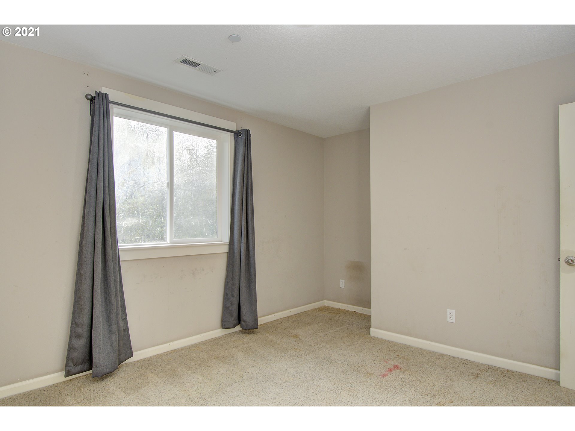 6909 Northeast Lessard Road Camas, WA 98607 - Photo 19 of 30 a view of an empty room with a window