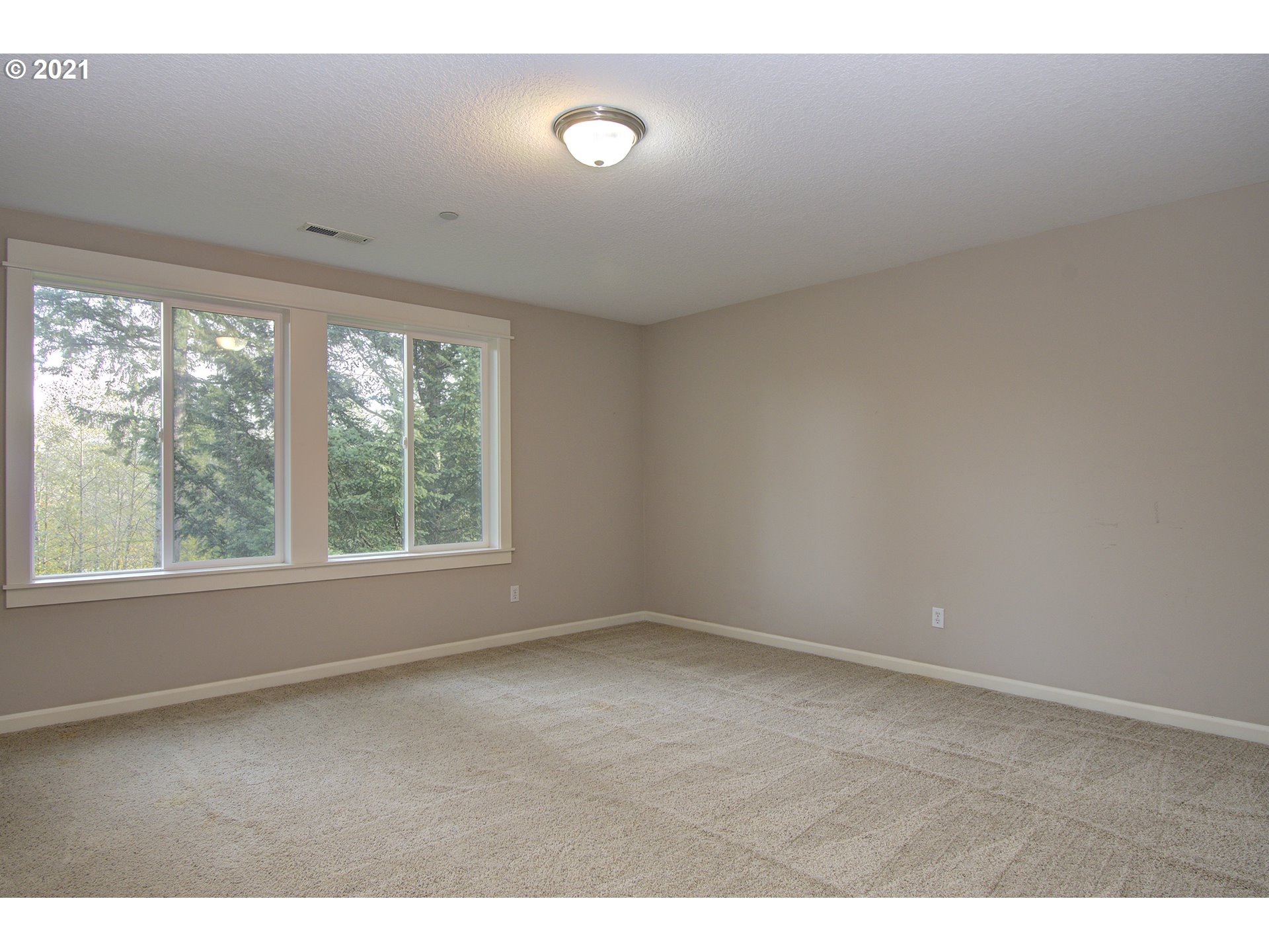 6909 Northeast Lessard Road Camas, WA 98607 - Photo 23 of 30 a view of an empty room with a window