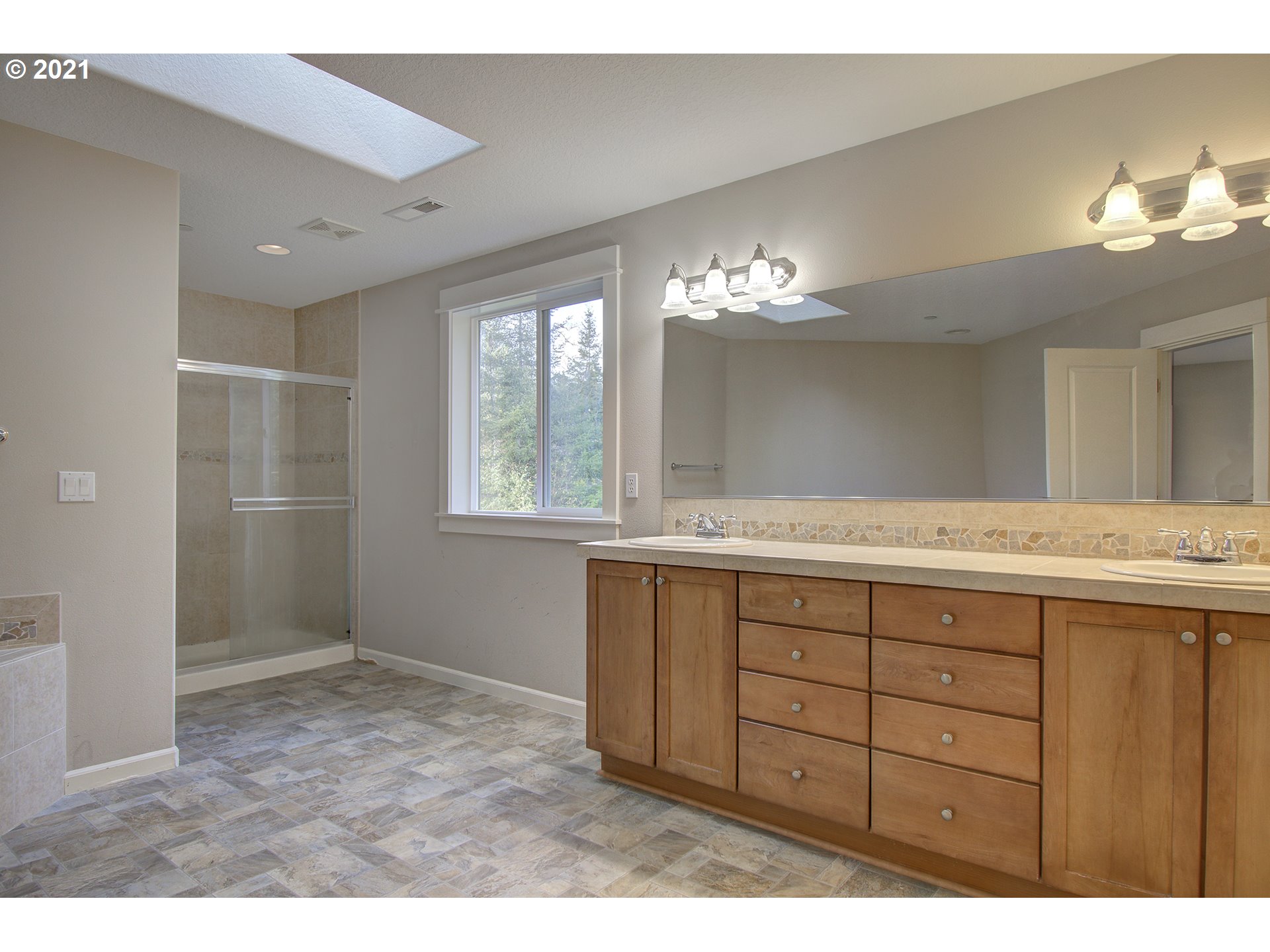 6909 Northeast Lessard Road Camas, WA 98607 - Photo 24 of 30 a bathroom with a sink vanity and a mirror