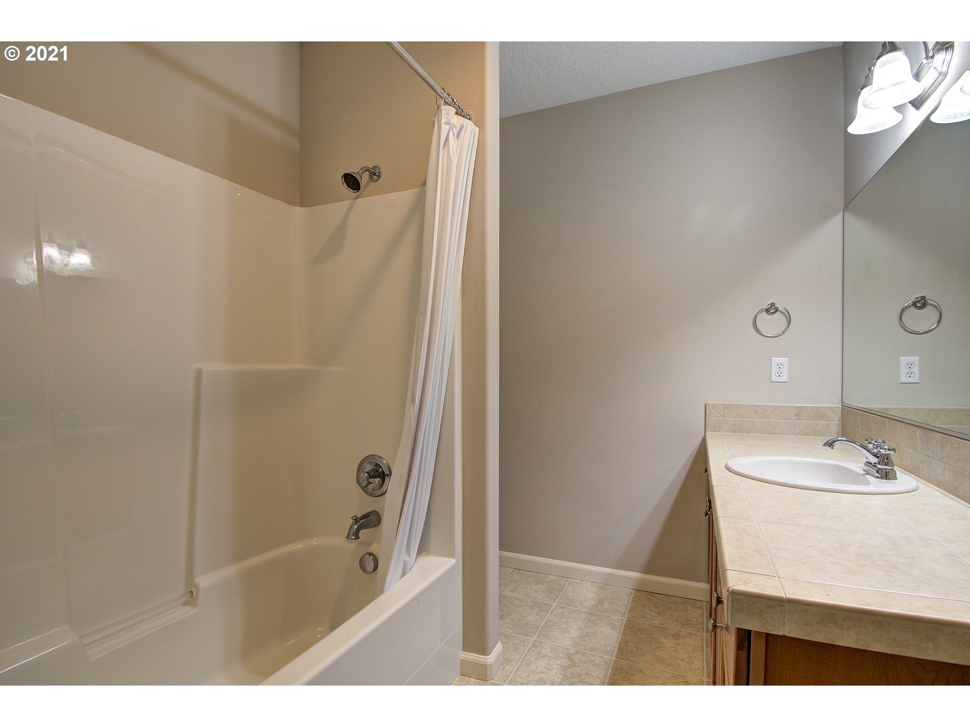 6909 Northeast Lessard Road Camas, WA 98607 - Photo 25 of 30 a bathroom with a bathtub and a sink