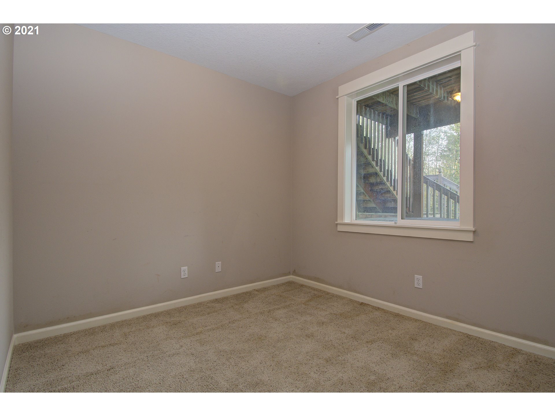 6909 Northeast Lessard Road Camas, WA 98607 - Photo 9 of 30 a view of an empty room with a window