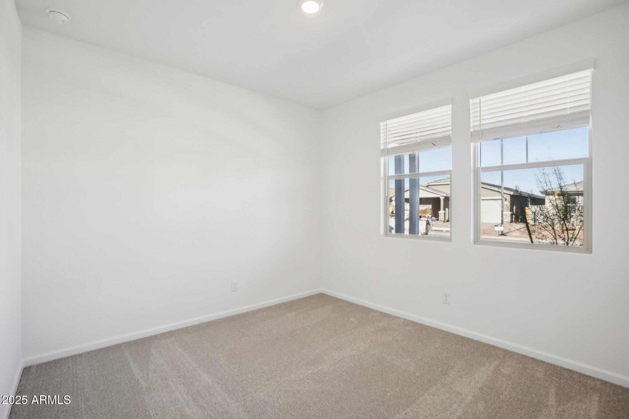 16219 West Bajada Road Surprise, AZ 85387 - Photo 15 of 43 an empty room with windows
