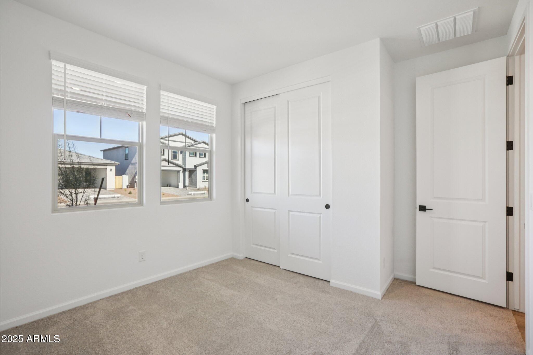 16219 West Bajada Road Surprise, AZ 85387 - Photo 16 of 43 a view of an empty room with a window