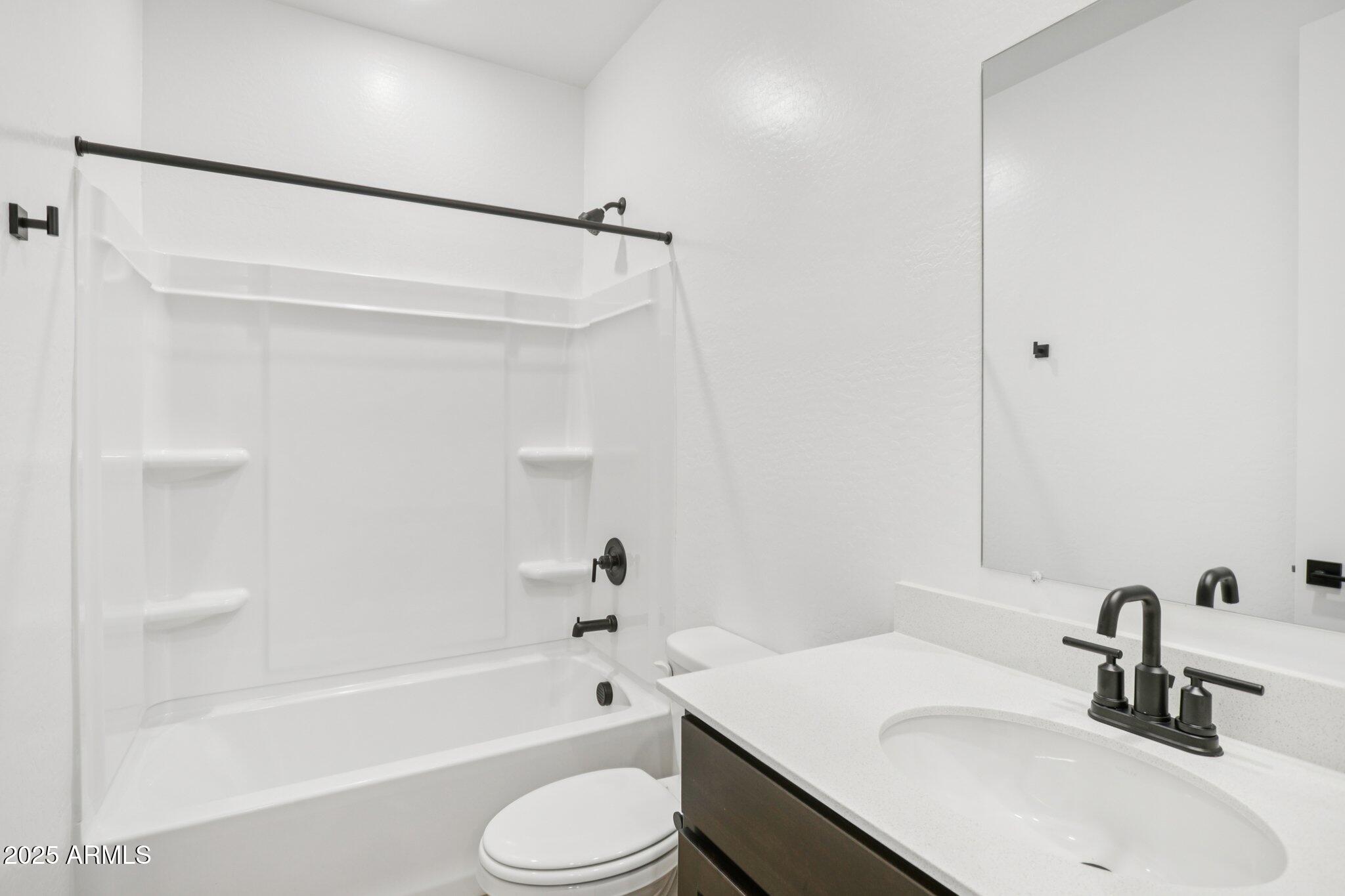 16219 West Bajada Road Surprise, AZ 85387 - Photo 17 of 43 a bathroom with a sink a toilet and a bathtub