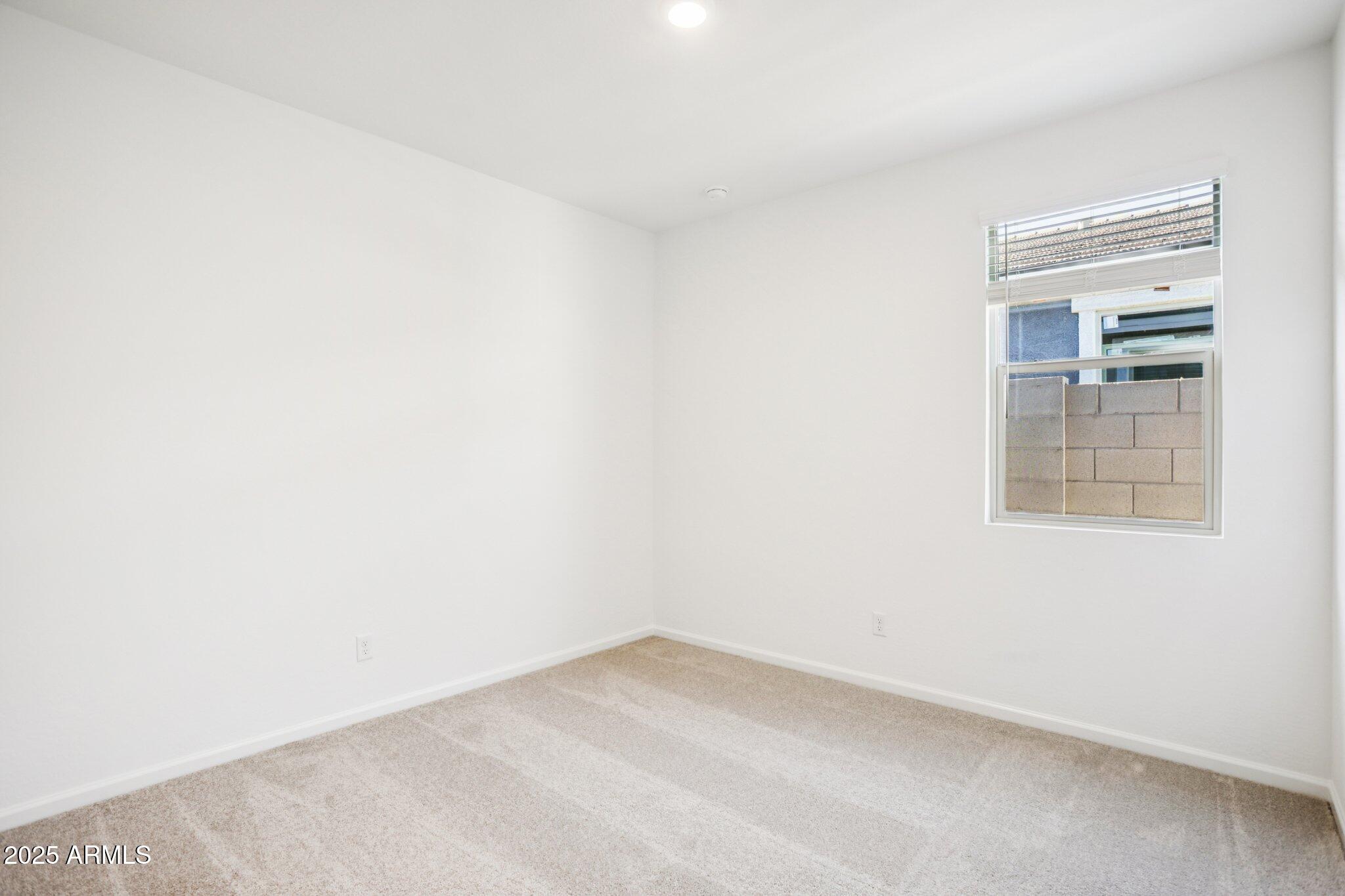 16219 West Bajada Road Surprise, AZ 85387 - Photo 18 of 43 an empty room with a window