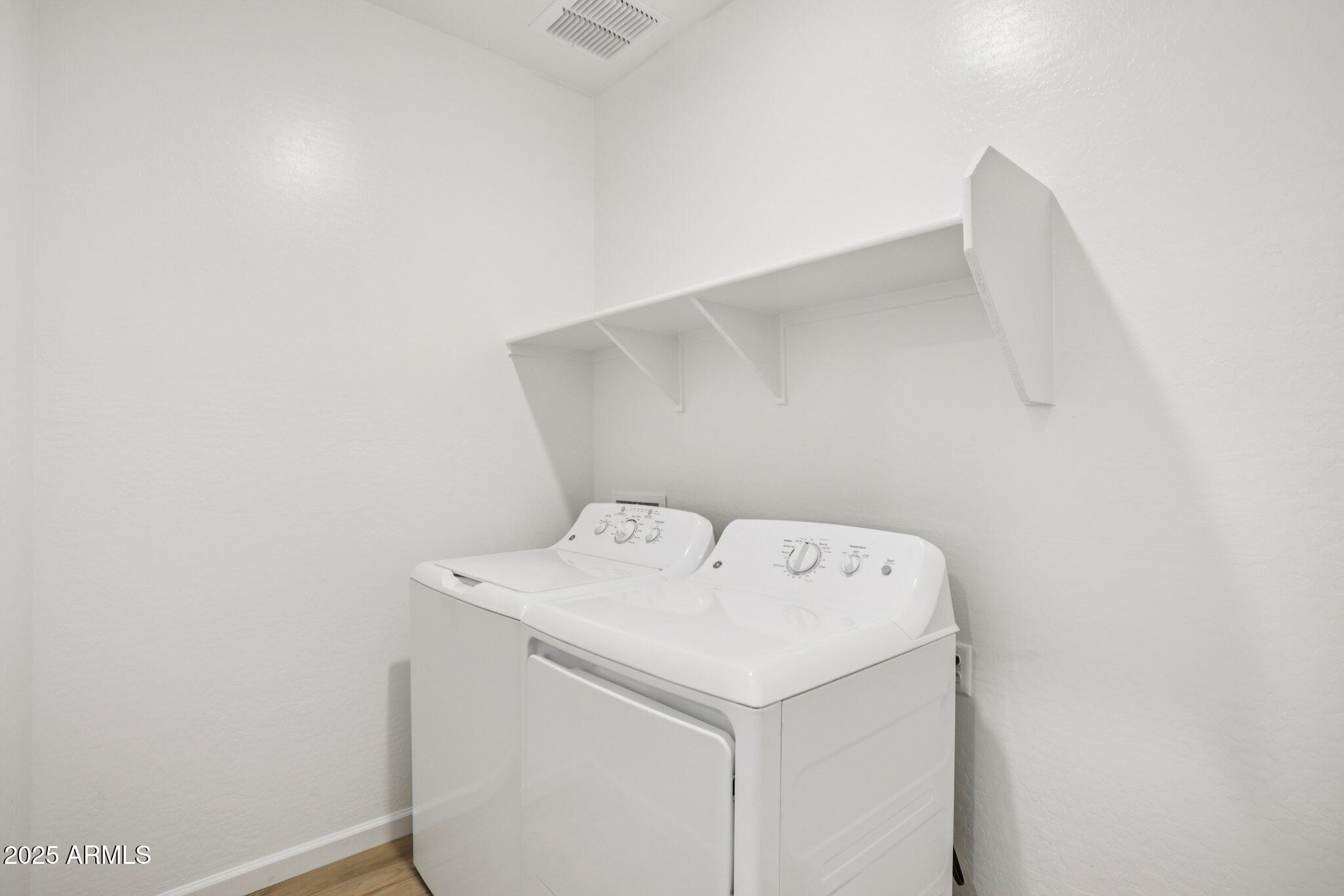 16219 West Bajada Road Surprise, AZ 85387 - Photo 20 of 43 a utility room with dryer and washer