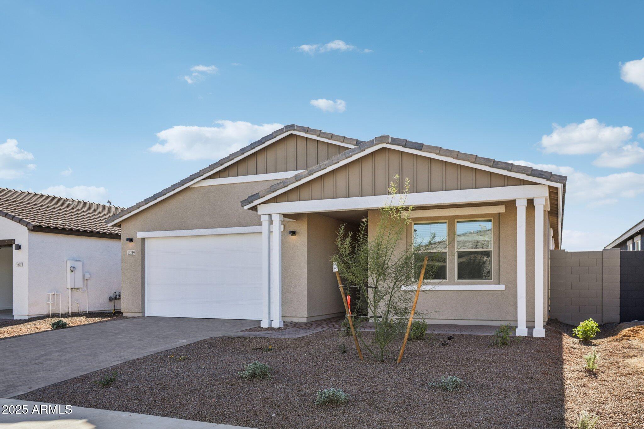 16219 West Bajada Road Surprise, AZ 85387 - Photo 2 of 43 a front view of a house with a yard