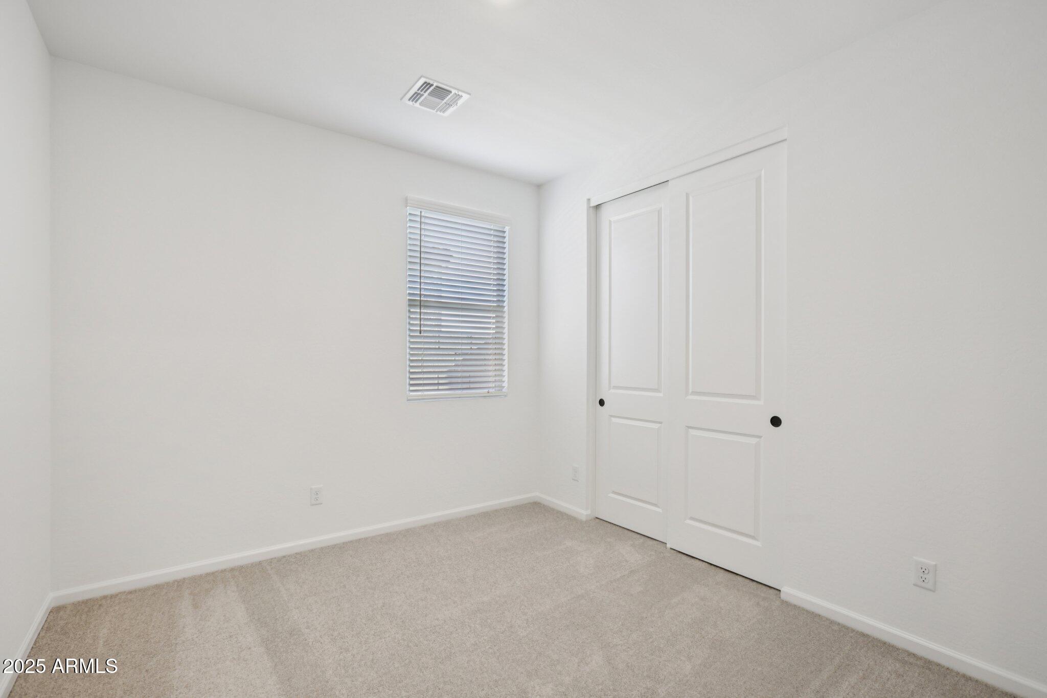 16219 West Bajada Road Surprise, AZ 85387 - Photo 24 of 43 a view of an empty room with a window