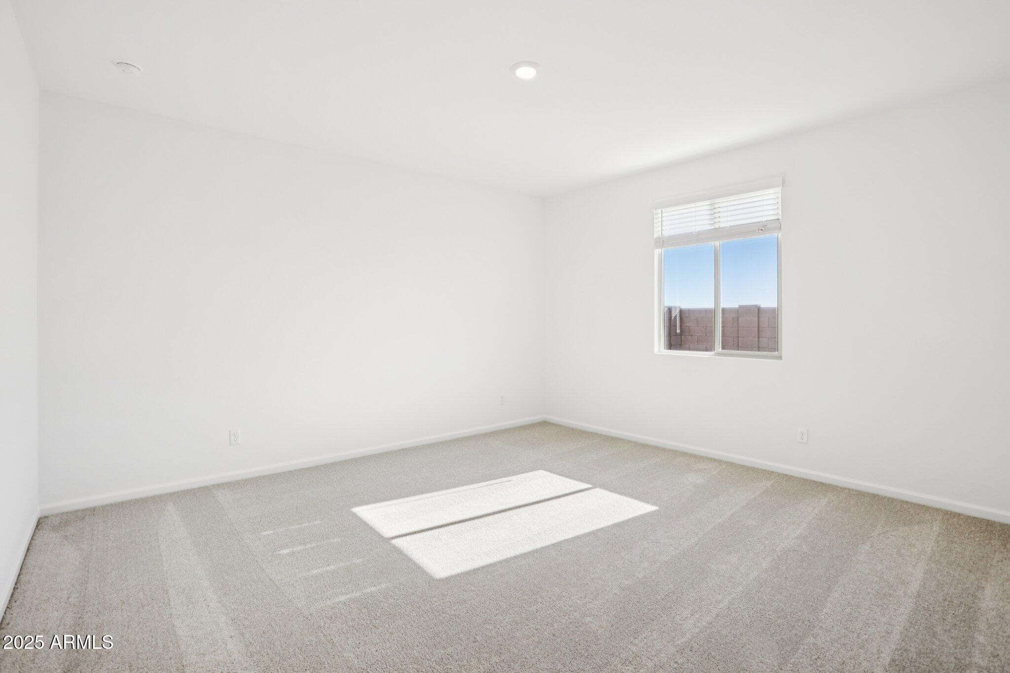16219 West Bajada Road Surprise, AZ 85387 - Photo 29 of 43 an empty room with a workbench
