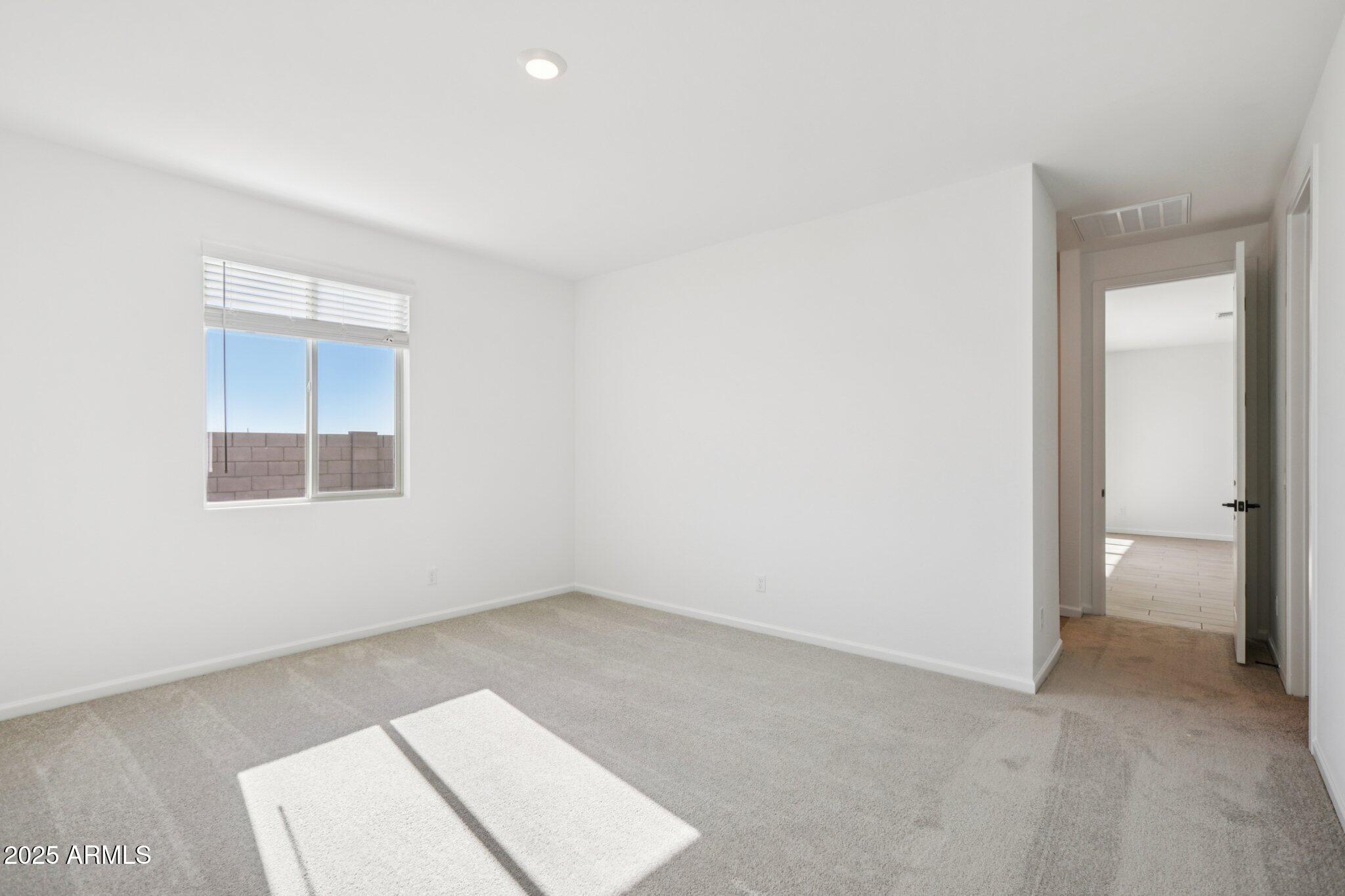 16219 West Bajada Road Surprise, AZ 85387 - Photo 30 of 43 an empty room with a window