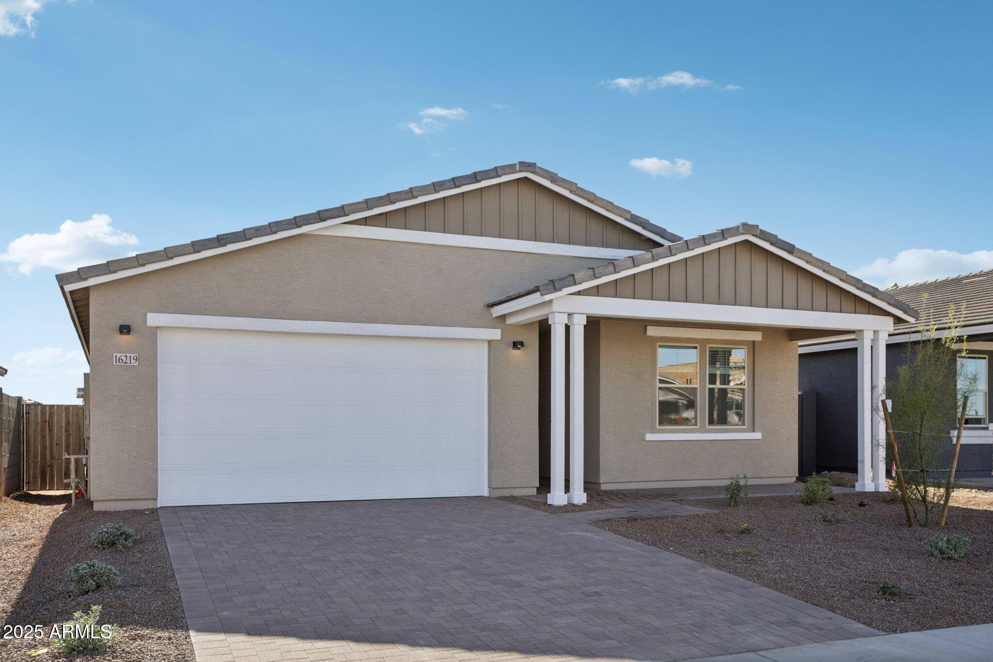 16219 West Bajada Road Surprise, AZ 85387 - Photo 3 of 43 a front view of a house with yard