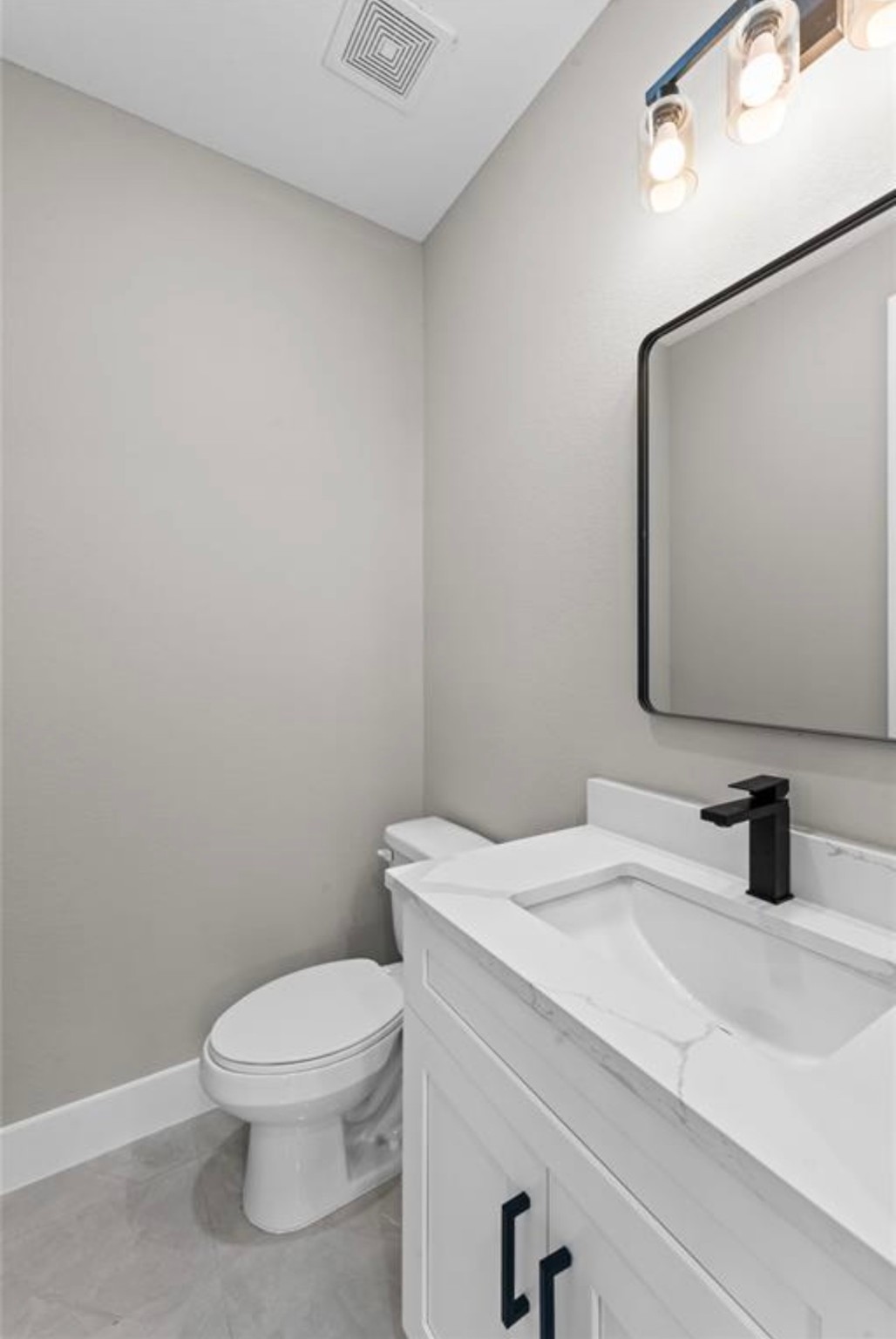 2614 Martinas Ct Spring Spring, TX 77388 - Photo 11 of 16 a bathroom with a toilet sink and mirror