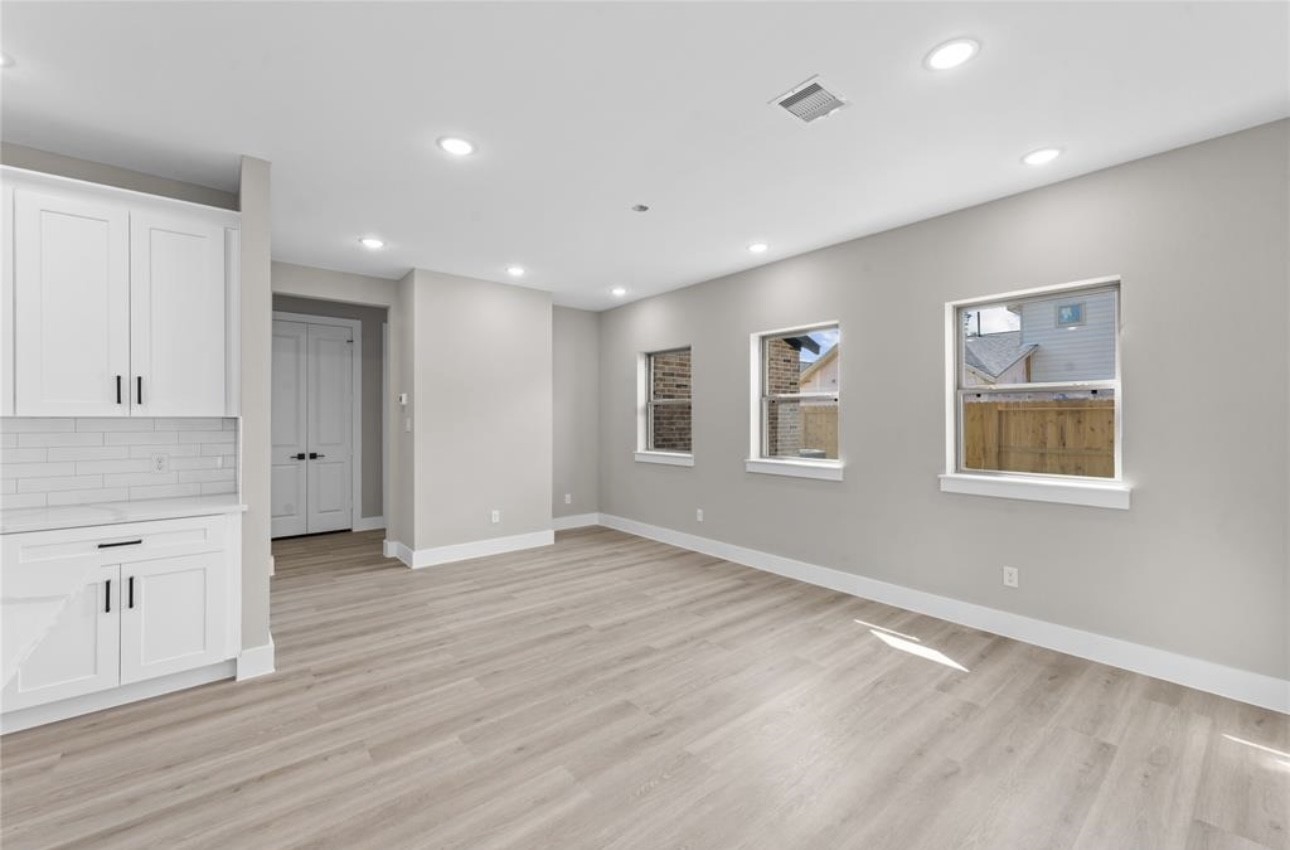 2614 Martinas Ct Spring Spring, TX 77388 - Photo 7 of 16 a view of an empty room with window and wooden floor
