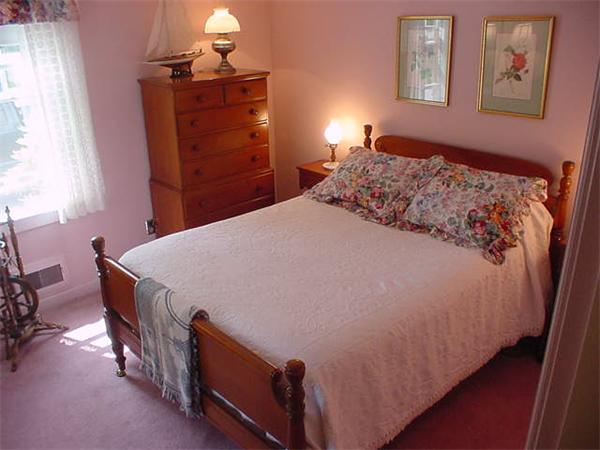 45 Shaker Lane Littleton, MA 01460 - Photo 18 of 30 a bedroom with a bed and a dresser