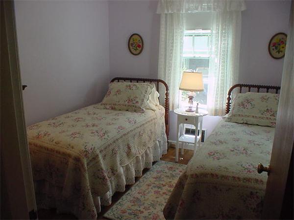 45 Shaker Lane Littleton, MA 01460 - Photo 19 of 30 a bedroom with a bed and a window
