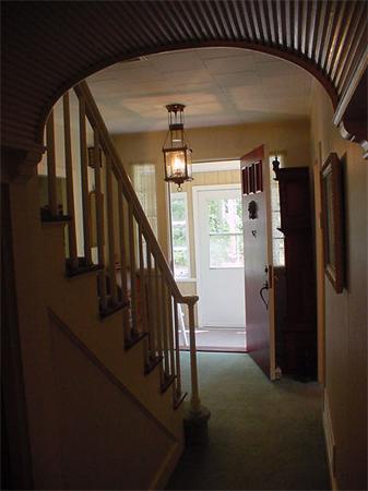 45 Shaker Lane Littleton, MA 01460 - Photo 2 of 30 a view of staircase with lots of frames and empty room
