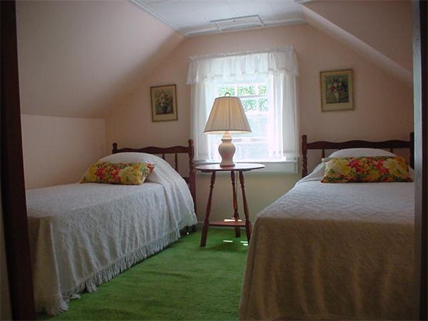45 Shaker Lane Littleton, MA 01460 - Photo 23 of 30 a bedroom with a bed and a window
