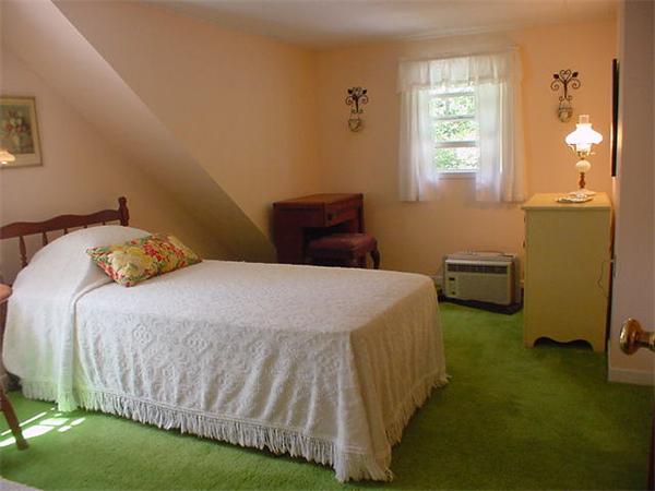 45 Shaker Lane Littleton, MA 01460 - Photo 24 of 30 a bedroom with a bed and a window