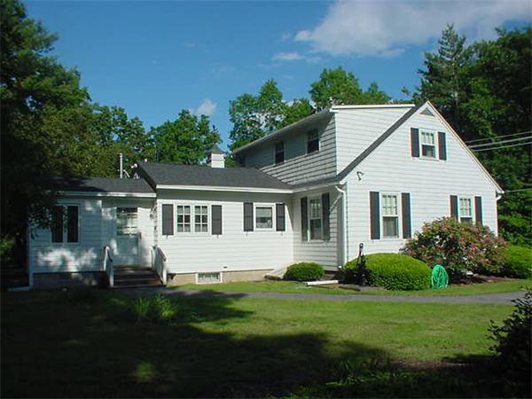45 Shaker Lane Littleton, MA 01460 - Photo 27 of 30 a front view of a house with a garden