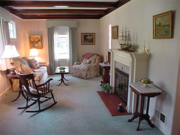 45 Shaker Lane Littleton, MA 01460 - Photo 5 of 30 a living room with furniture and a fireplace