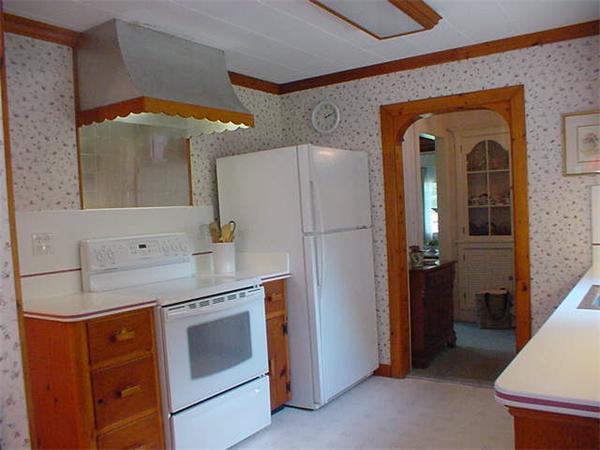 45 Shaker Lane Littleton, MA 01460 - Photo 10 of 30 a kitchen with stainless steel appliances granite countertop a refrigerator and a sink