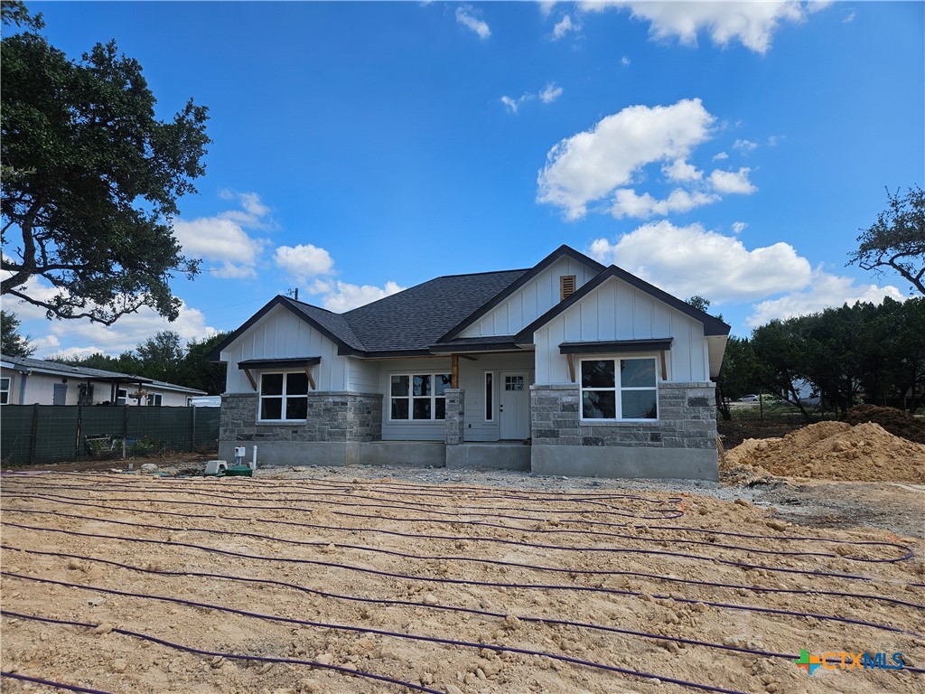 535 Buck Run Pass Canyon Lake, TX 78133 - Photo 1 of 1 a front view of a house with a yard