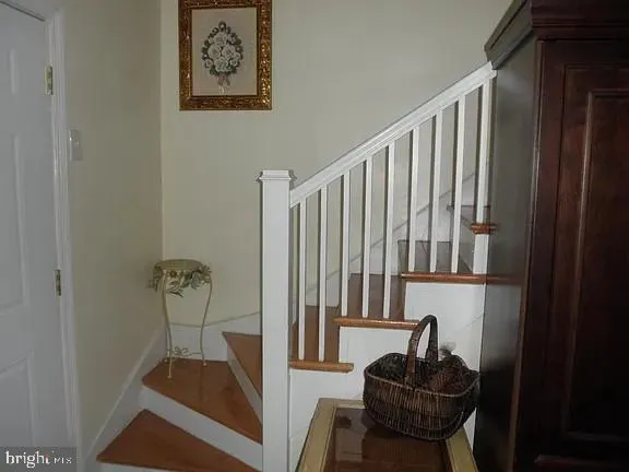a view of hallway with furniture and a rug