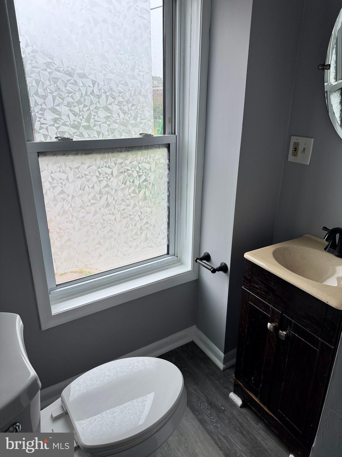 1001 Light Street, Unit 3 Baltimore, MD 21230 - Photo 12 of 14 a bathroom with a toilet sink and window