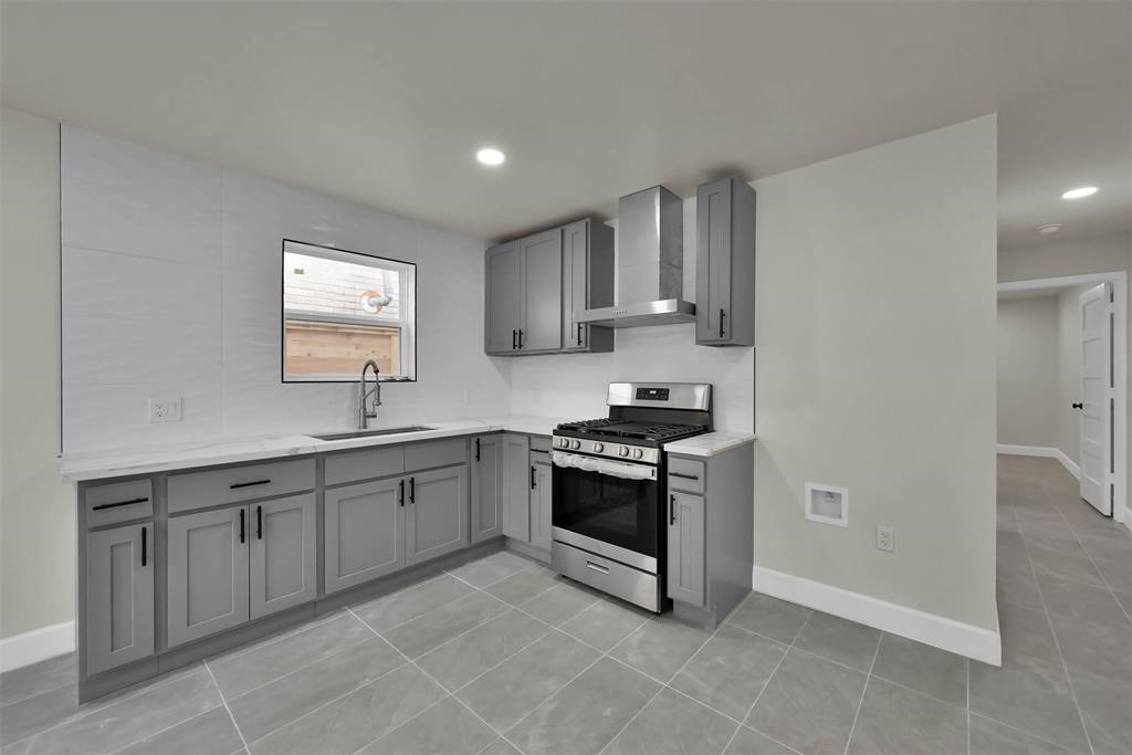 2304 Chapman Street, Unit 3 Houston, TX 77009 - Photo 5 of 17 a kitchen with white cabinets and appliances