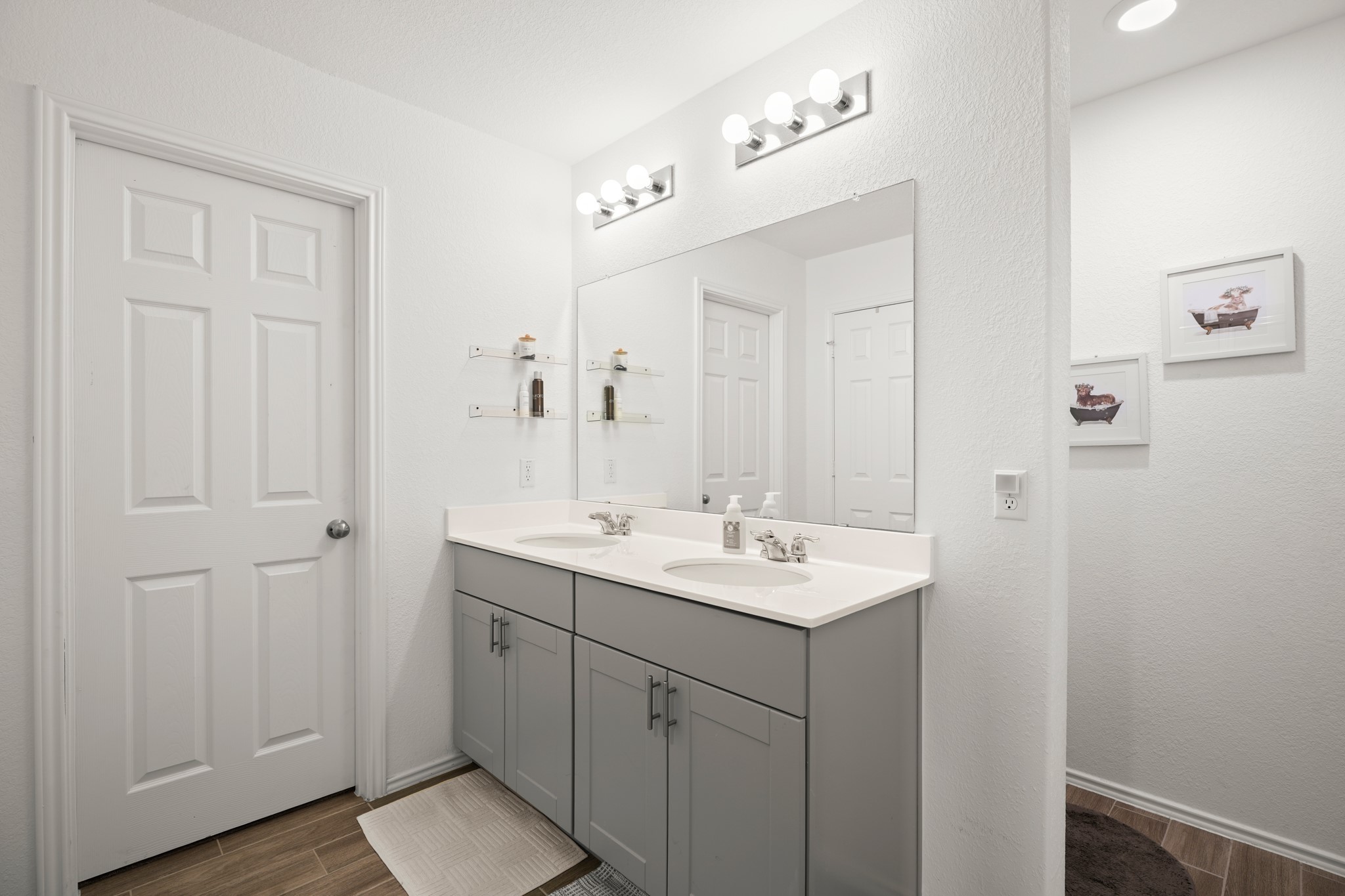 500 Pickrell Loop Georgetown, TX 78628 - Photo 17 of 29 a bathroom with a double vanity sink and mirror