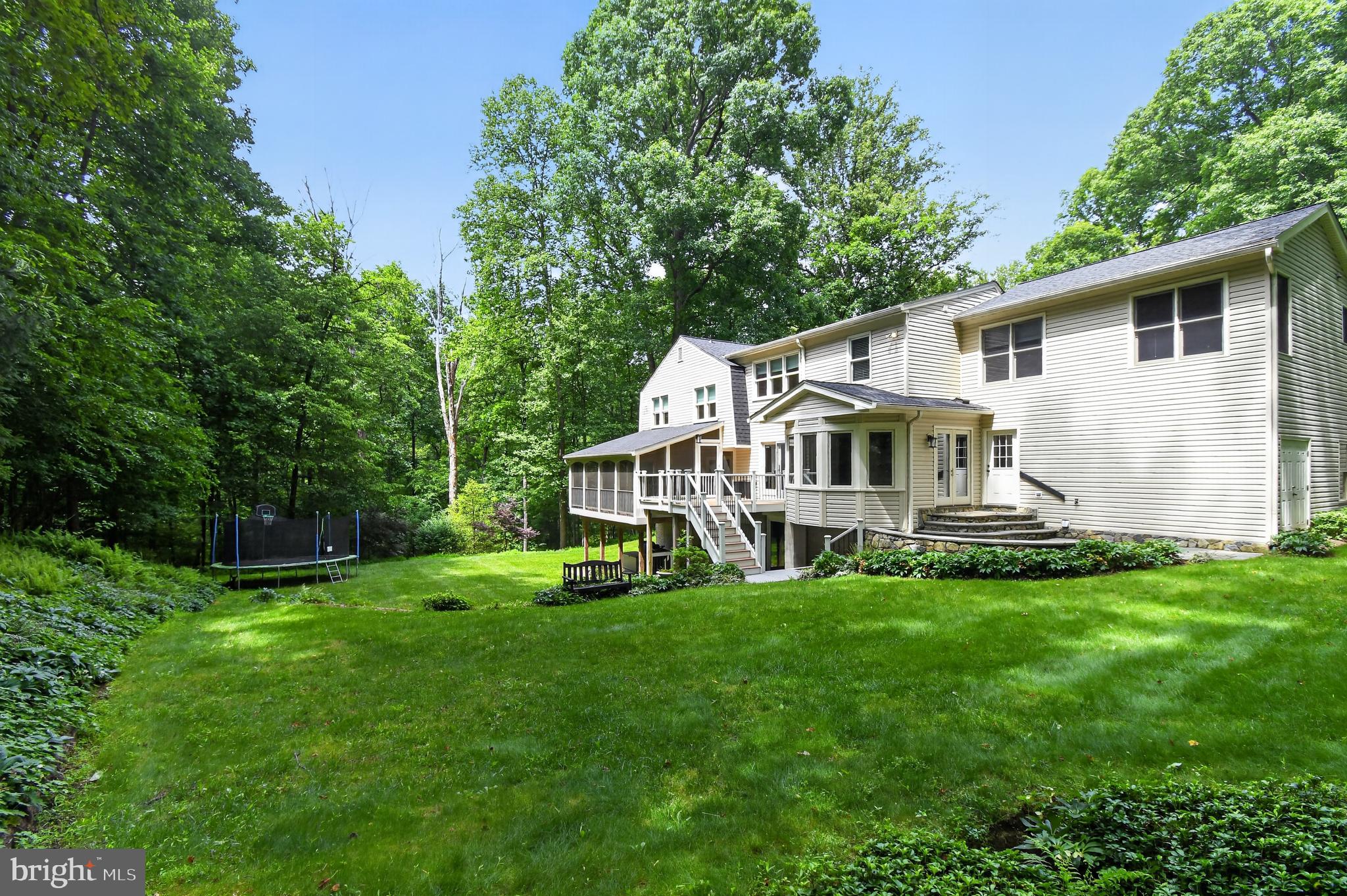 11728 Stuart Mill Road Oakton, VA 22124 - Photo 54 of 68 Serene backyard oasis in lush greenery.
