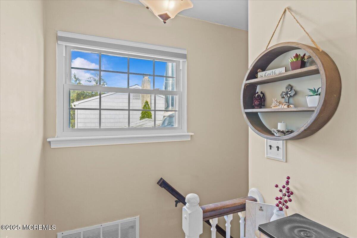 2110 Lanes Mill Road Brick, NJ 08724 - Photo 22 of 55 a front view of a house with wooden floor and small white walls