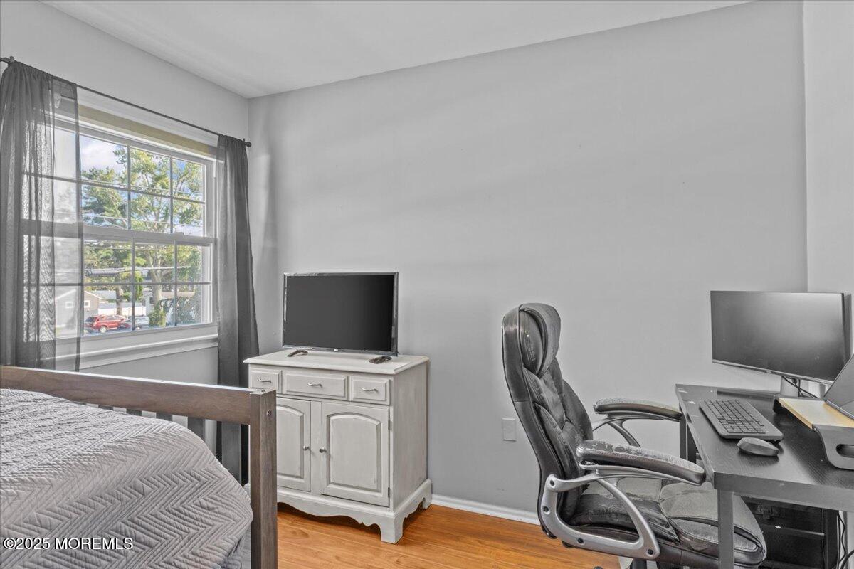 2110 Lanes Mill Road Brick, NJ 08724 - Photo 25 of 55 a bedroom with furniture and a window