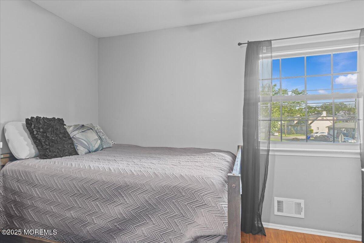 2110 Lanes Mill Road Brick, NJ 08724 - Photo 27 of 55 a large bed sitting in a bedroom next to a window