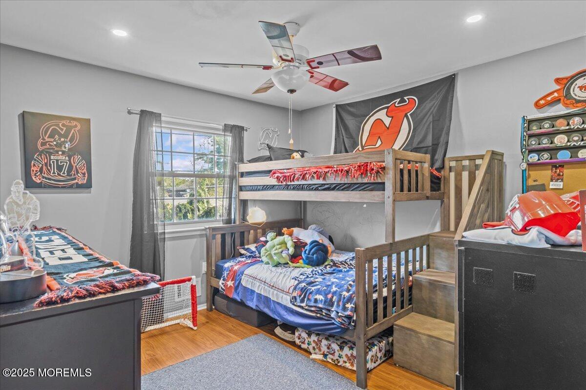 2110 Lanes Mill Road Brick, NJ 08724 - Photo 28 of 55 a bedroom with a bed and wooden floor