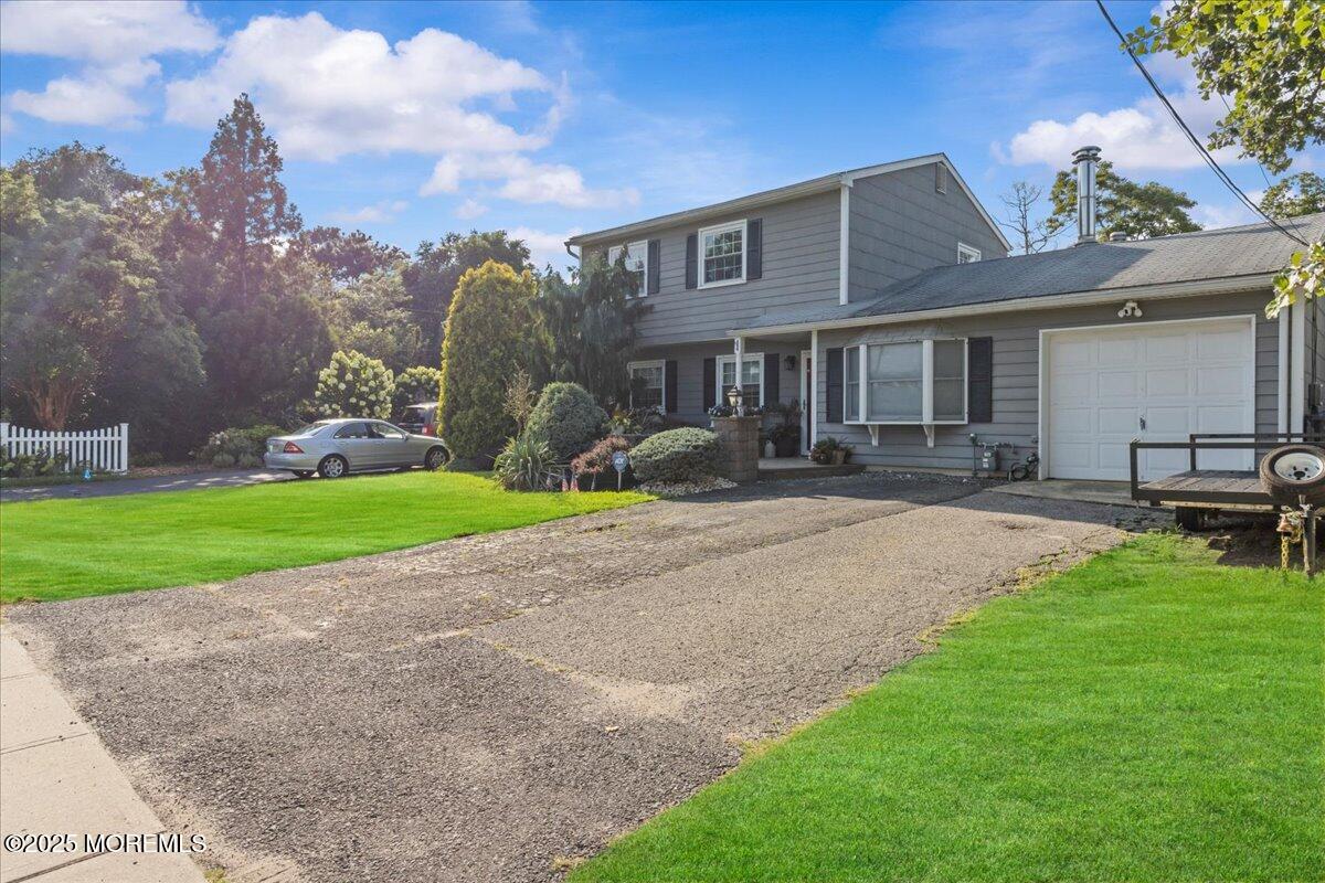 2110 Lanes Mill Road Brick, NJ 08724 - Photo 3 of 55 a front view of house with yard and green space