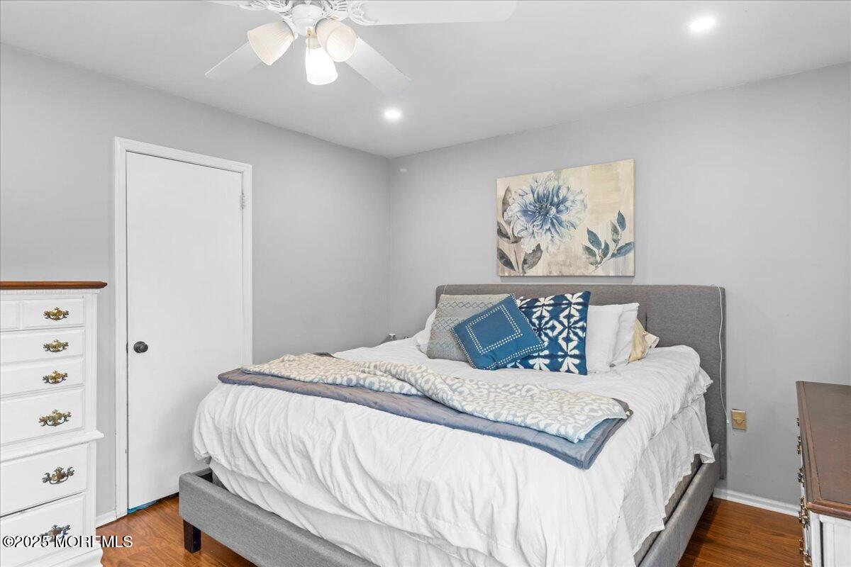 2110 Lanes Mill Road Brick, NJ 08724 - Photo 31 of 55 a bedroom with a bed and a painting on the wall